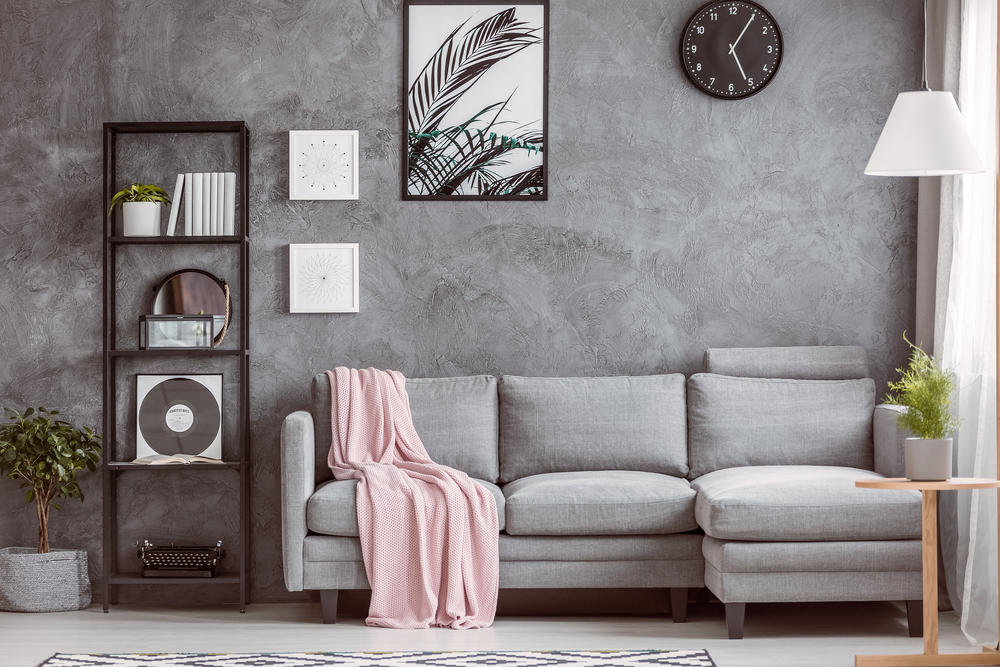 Stylish,living,room,with,comfortable,grey,corner,sofa,,small,tree